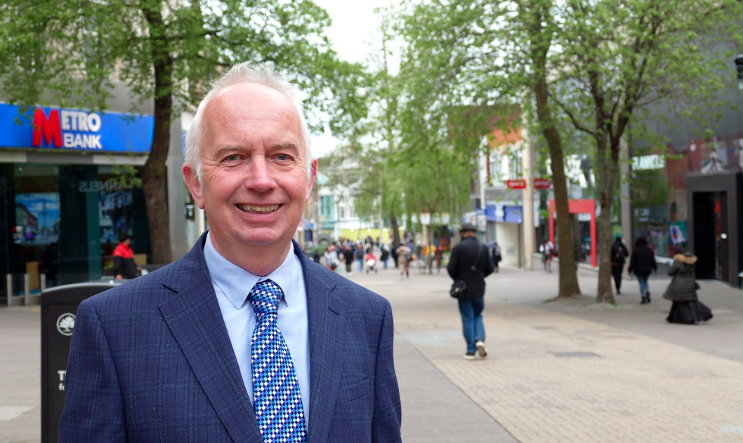 Leader of the Council, Councillor Barry Lewis standing in Sutton High Street