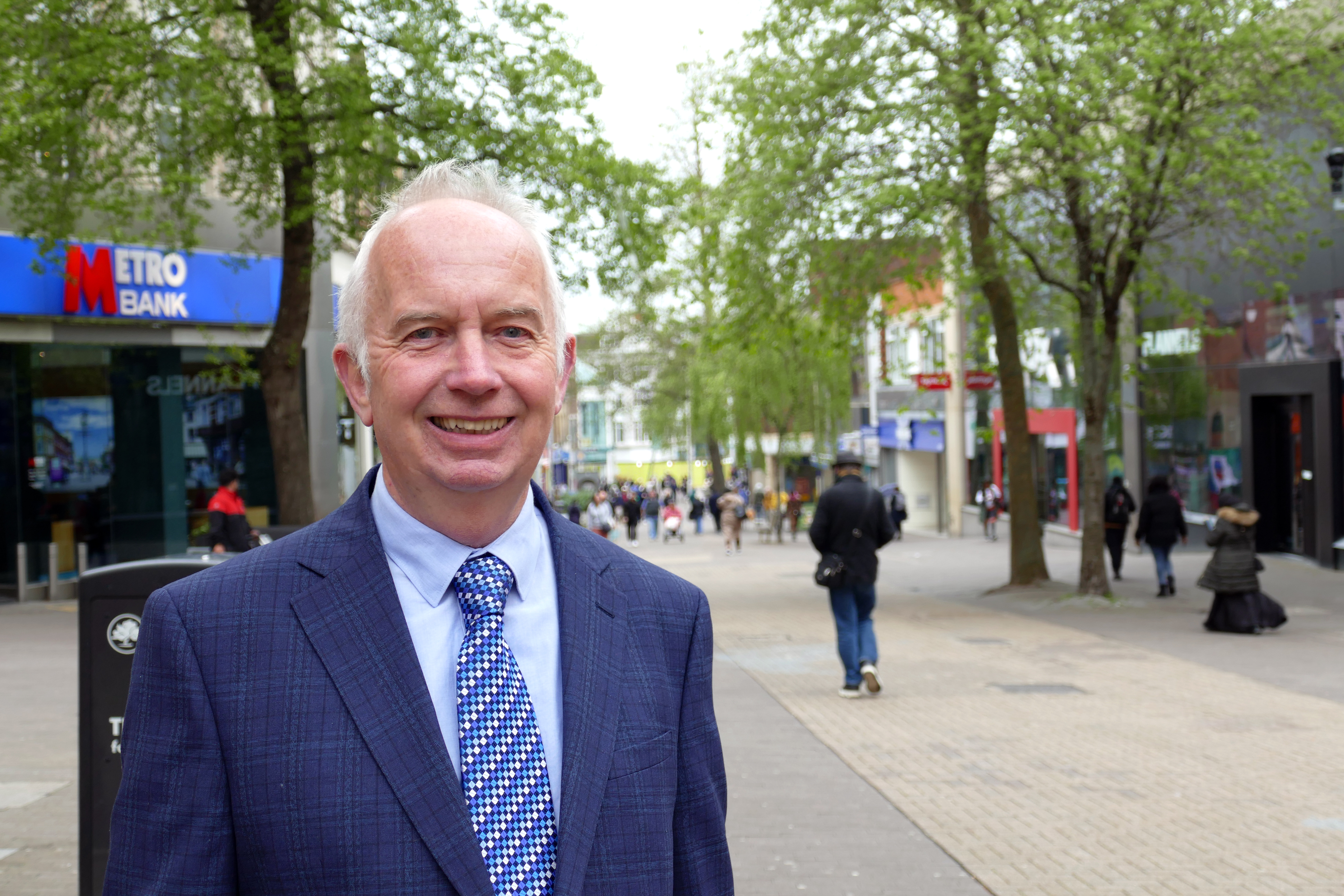 Council Leader Barry Lewis standing in Sutton High Street