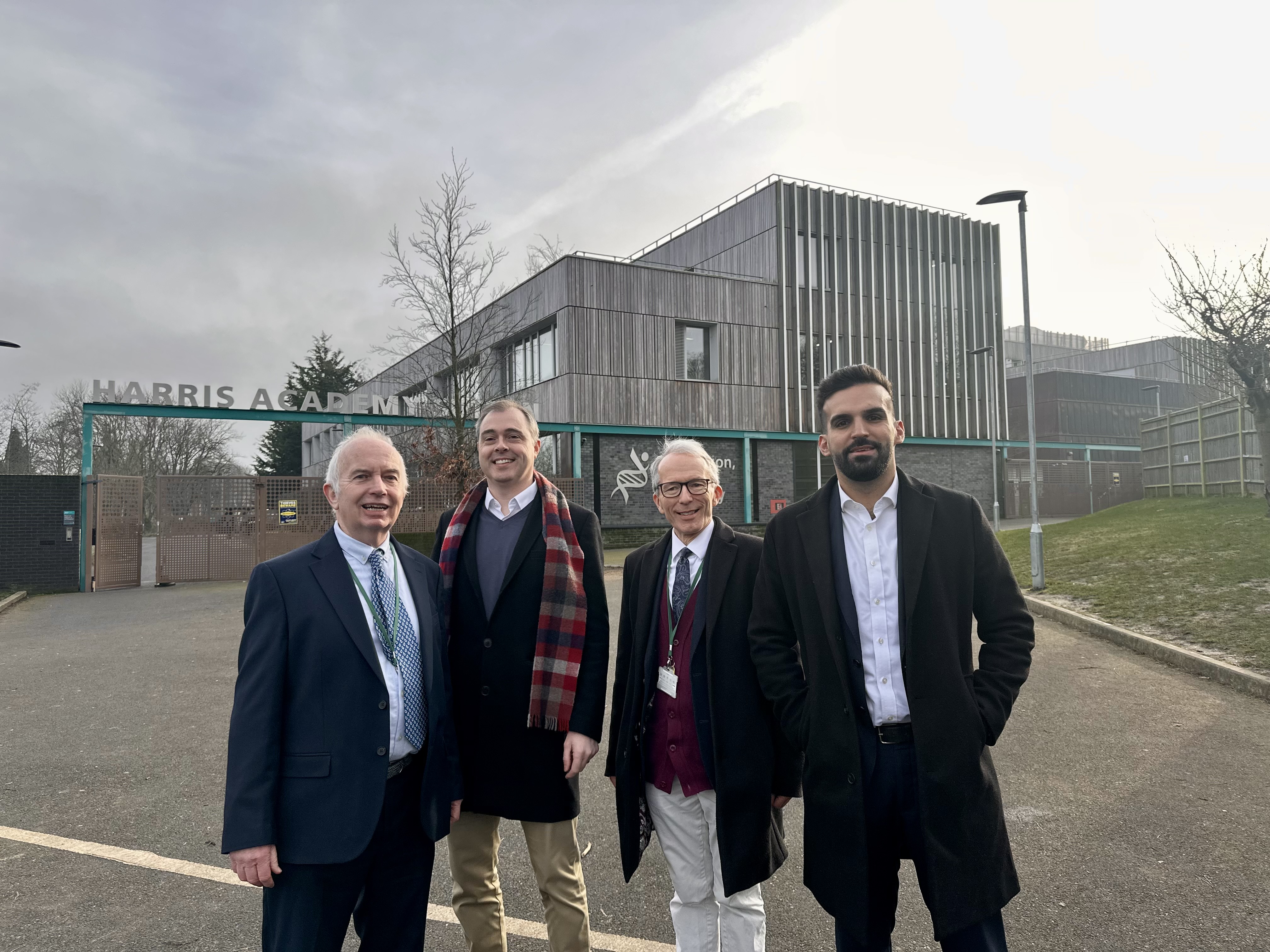 Leader of the Council Barry Lewis and Deputy Mayor for Environment and Energy Mete Coban MBE with two other men standing outside Harris Academy School in Belmont.