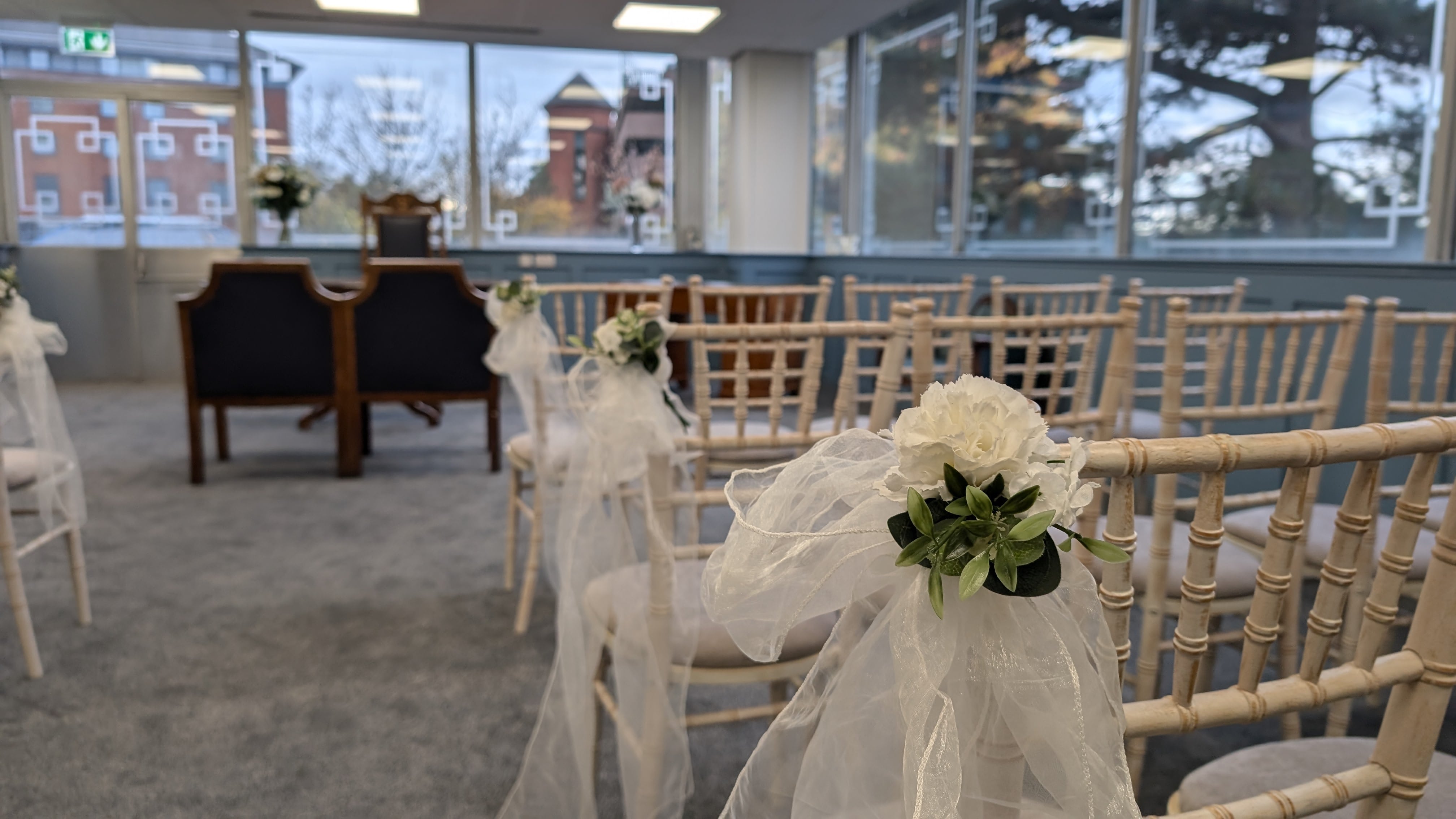 Sutton Registry office showing decorated chairs and ceremony table 